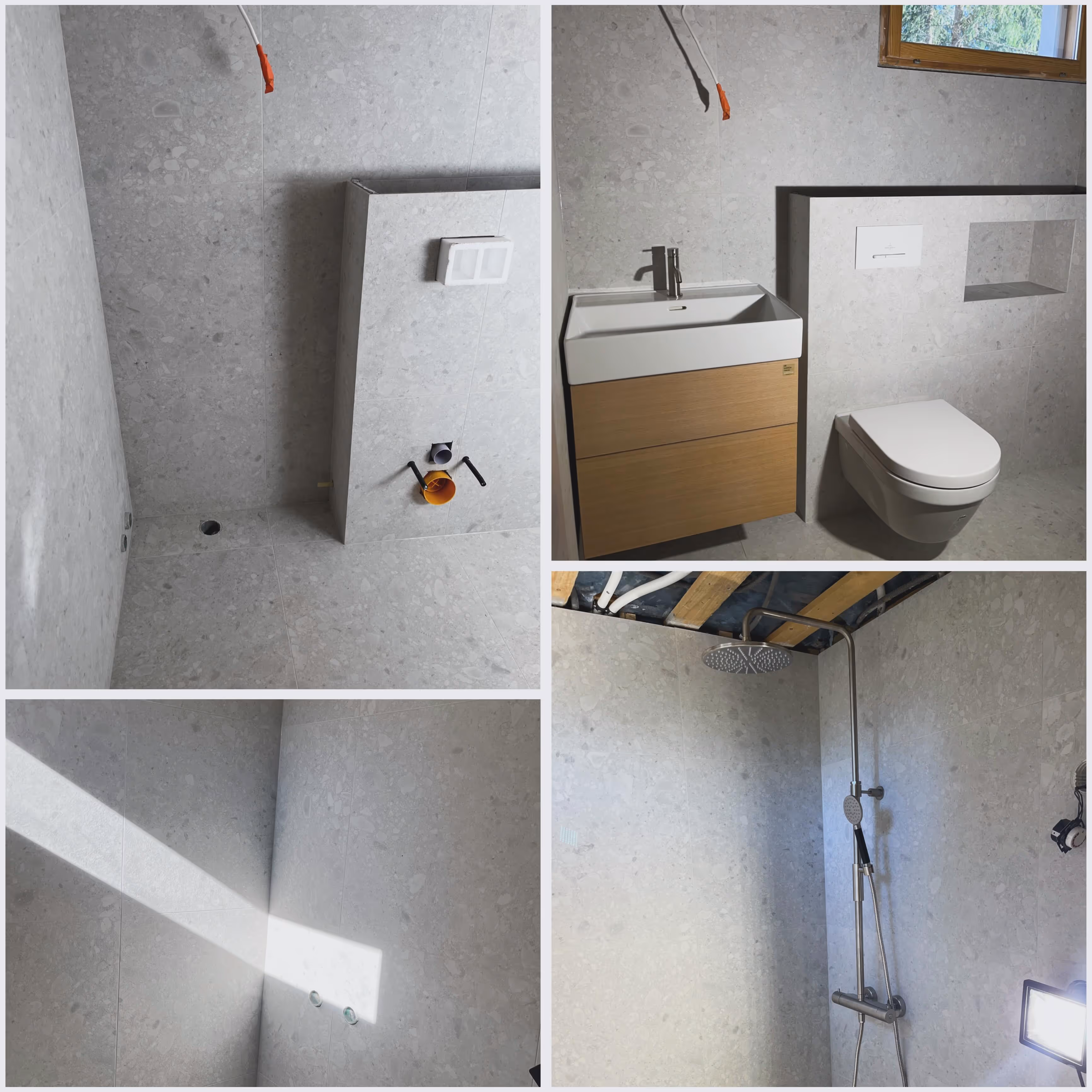 Kylpyhuoneen rakennusvaihe, jossa näkyy harmaat laatoitetut seinät, wc-istuin, allaskaappi ja suihku putkiasennuksineen.